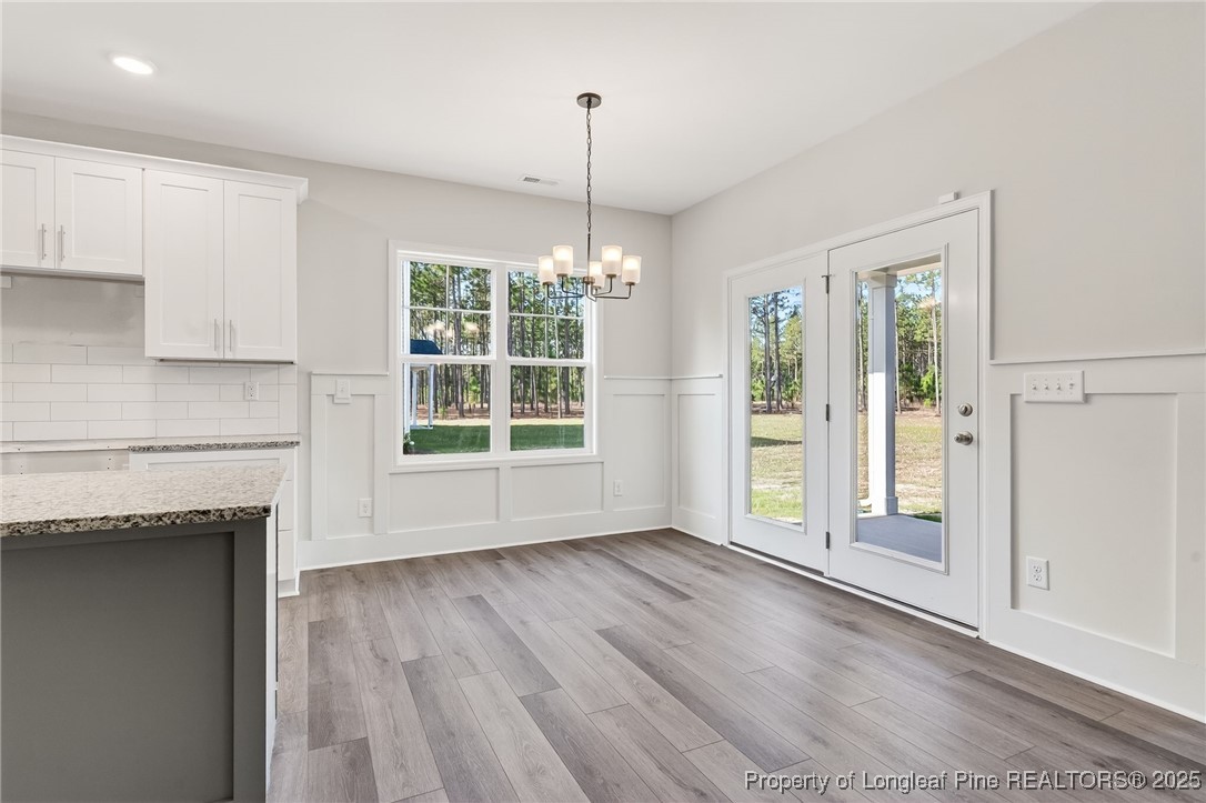 2202 Montrose (lot 3) Road Raeford, NC 28376 - Photo 14 of 44 a view of an empty room with a window and wooden floor