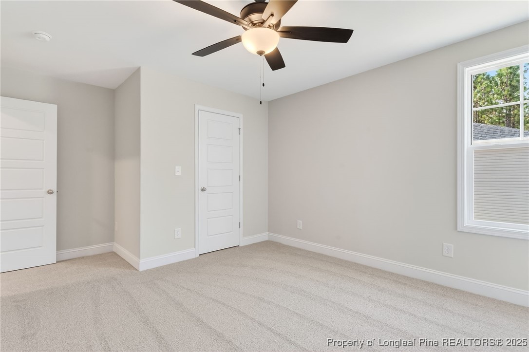2202 Montrose (lot 3) Road Raeford, NC 28376 - Photo 20 of 44 an empty room with fan and windows