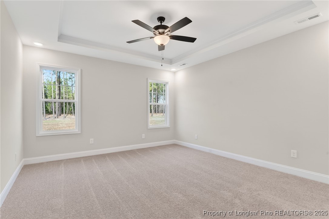 2202 Montrose (lot 3) Road Raeford, NC 28376 - Photo 24 of 44 an empty room with windows and ceiling fan