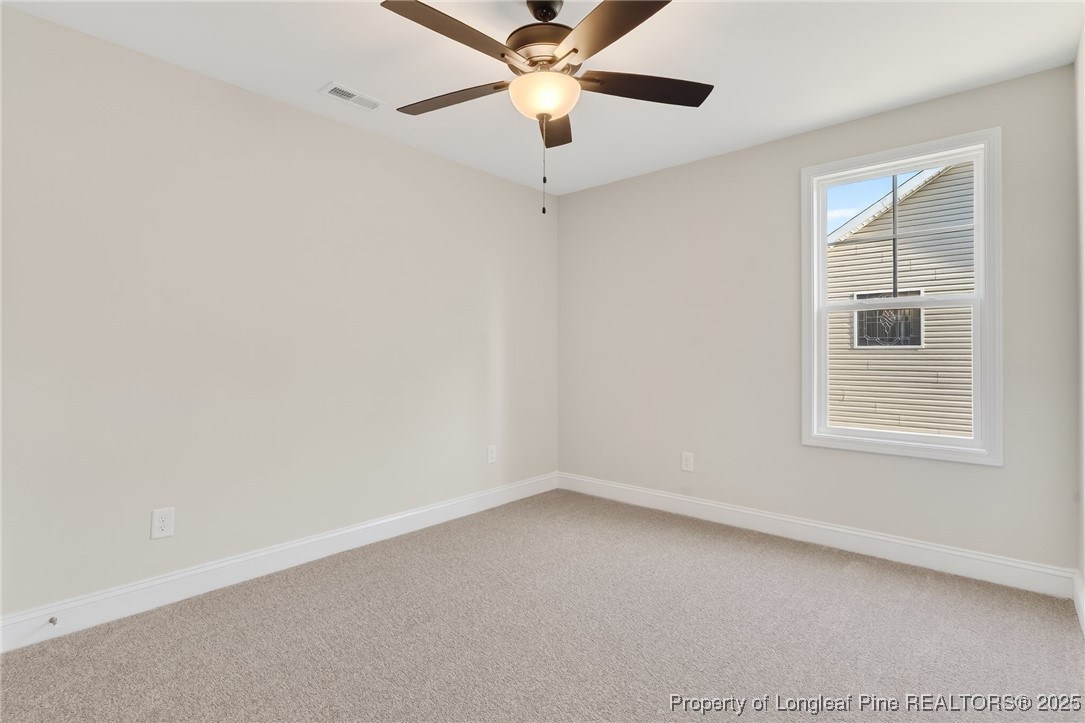 2202 Montrose (lot 3) Road Raeford, NC 28376 - Photo 28 of 44 an empty room with a window and a fan