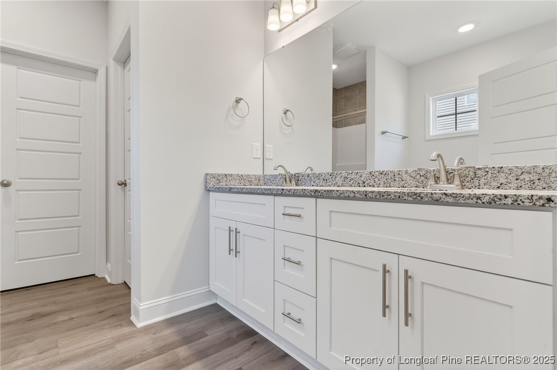 2202 Montrose (lot 3) Road Raeford, NC 28376 - Photo 33 of 44 a bathroom with a granite countertop sink and a mirror