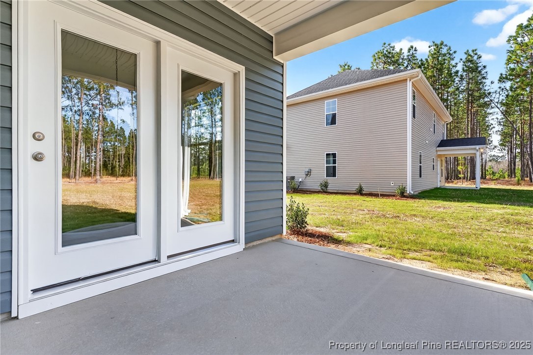 2202 Montrose (lot 3) Road Raeford, NC 28376 - Photo 39 of 44 a view of an house with backyard space and balcony