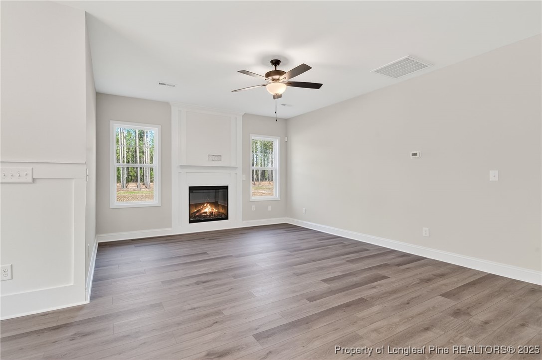 2202 Montrose (lot 3) Road Raeford, NC 28376 - Photo 6 of 44 a view of an empty room with window and wooden floor