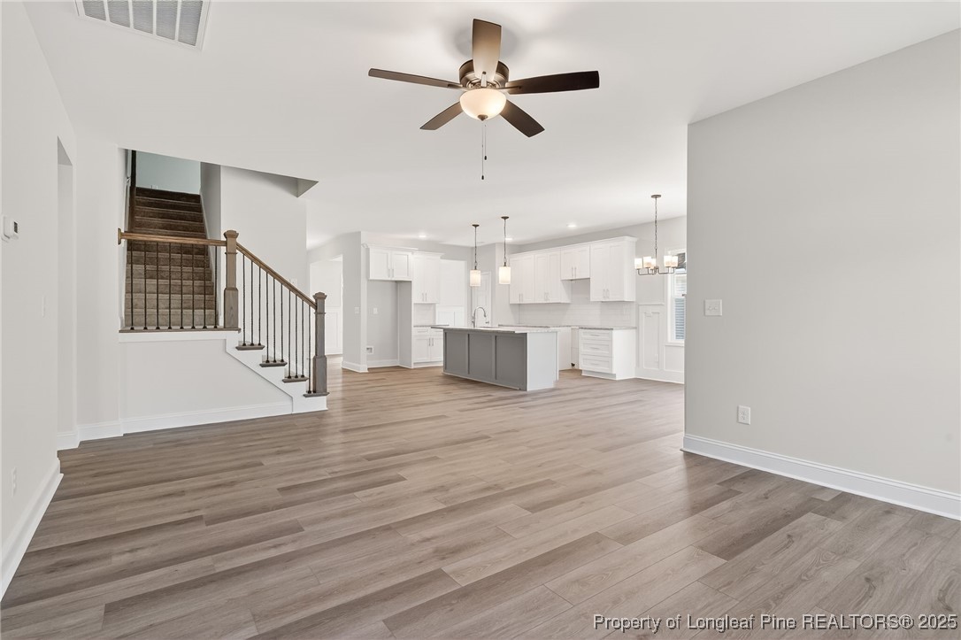 2202 Montrose (lot 3) Road Raeford, NC 28376 - Photo 7 of 44 a view of kitchen and empty room with wooden floor