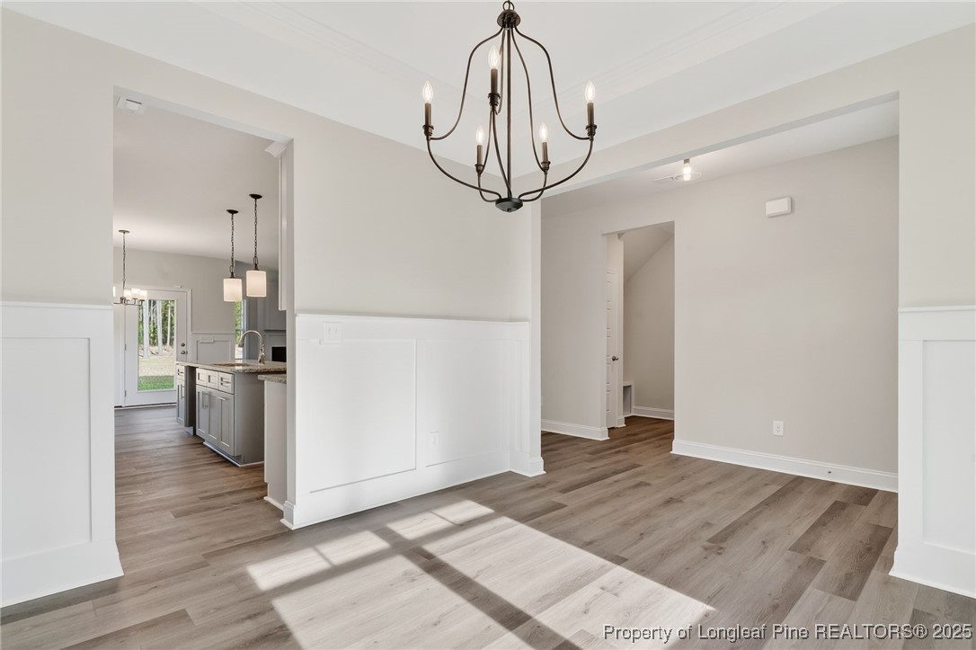 2202 Montrose (lot 3) Road Raeford, NC 28376 - Photo 9 of 44 a view of a kitchen with a sink and dishwasher a refrigerator with wooden floor