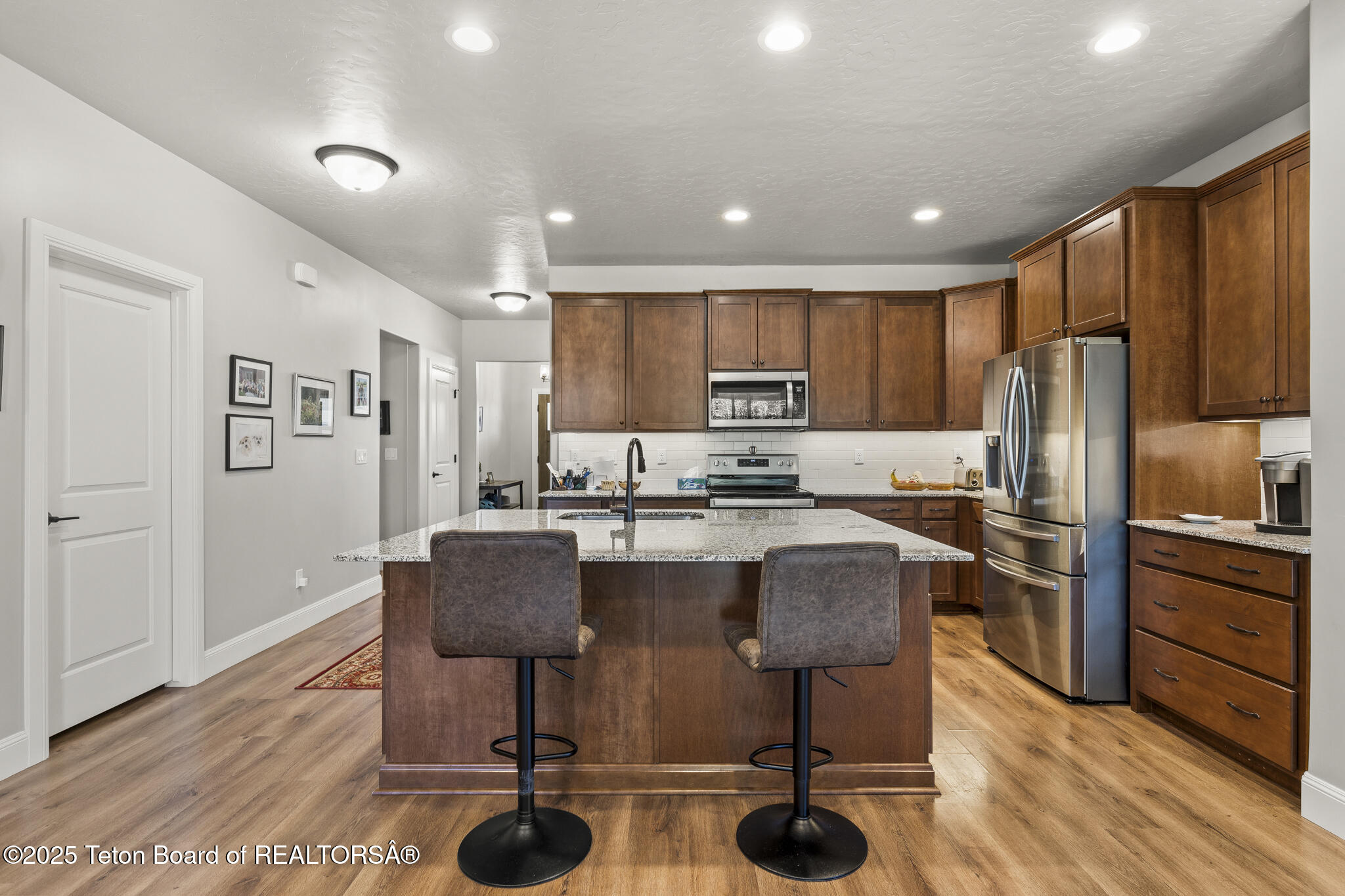 282 Harris Hawk Drive Victor, ID 83455 - Photo 6 of 23 Kitchen and Front Hall