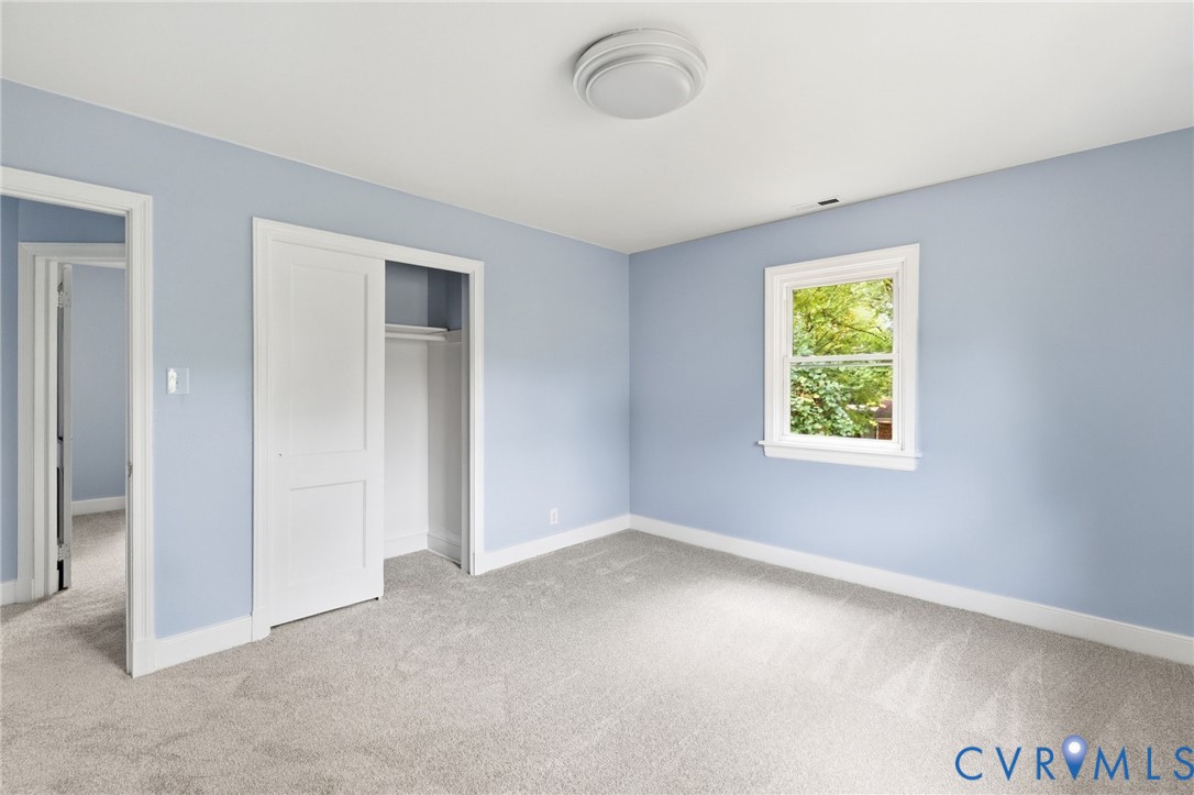 5901 Bonneau Road Richmond, VA 23227 - Photo 16 of 21 Light-toned carpet flooring, a single window with
