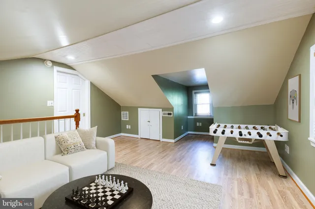 a living room with furniture rug and window