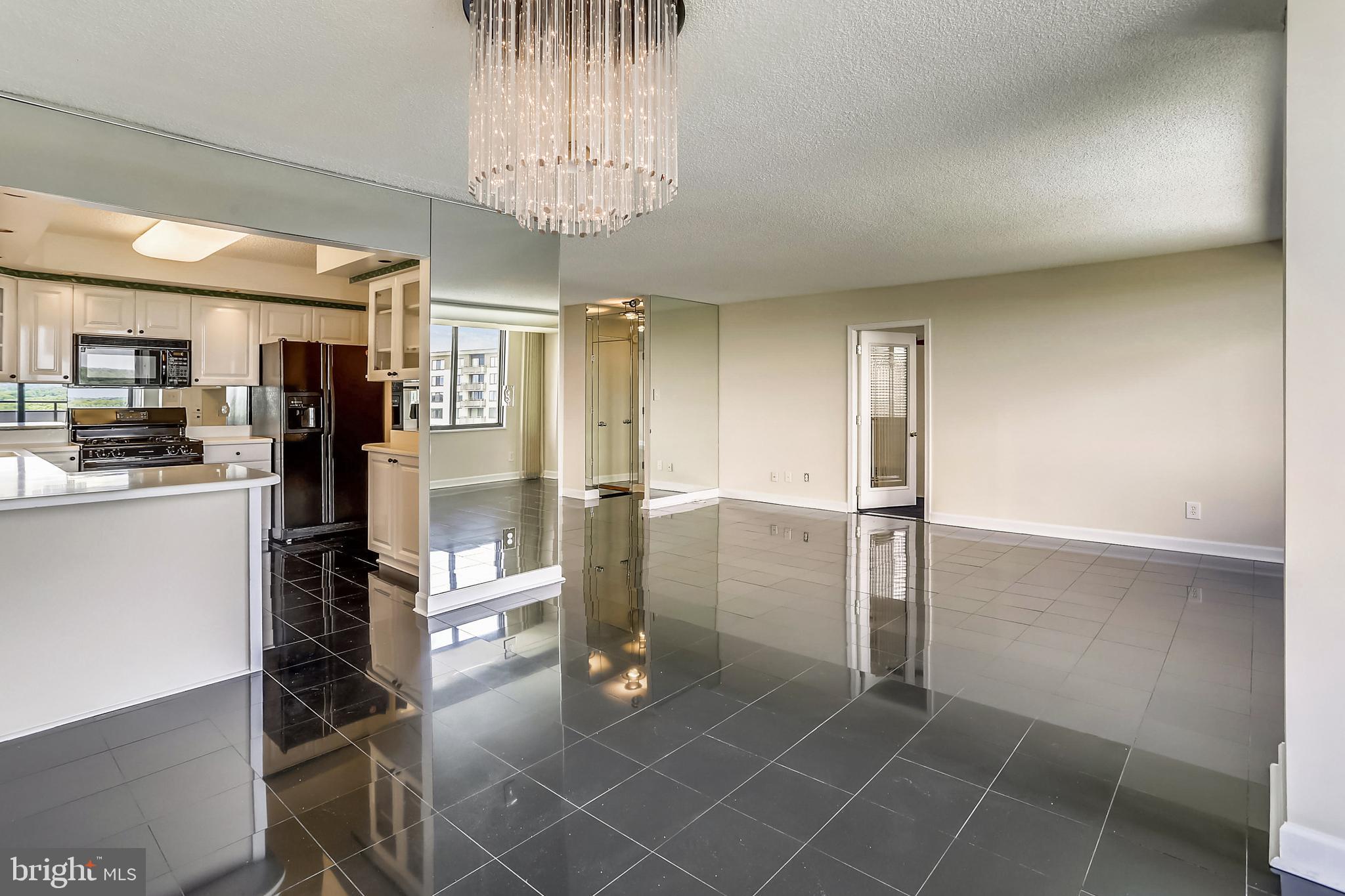 5225 Pooks Hill Road, Unit 1619S Bethesda, MD 20814 - Photo 4 of 54 Living area with view of kitchen and bedroom entry