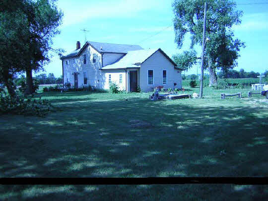 3223 Markham Road Winnebago, IL 61088 - Photo 1 of 1 a front view of house with yard and green space
