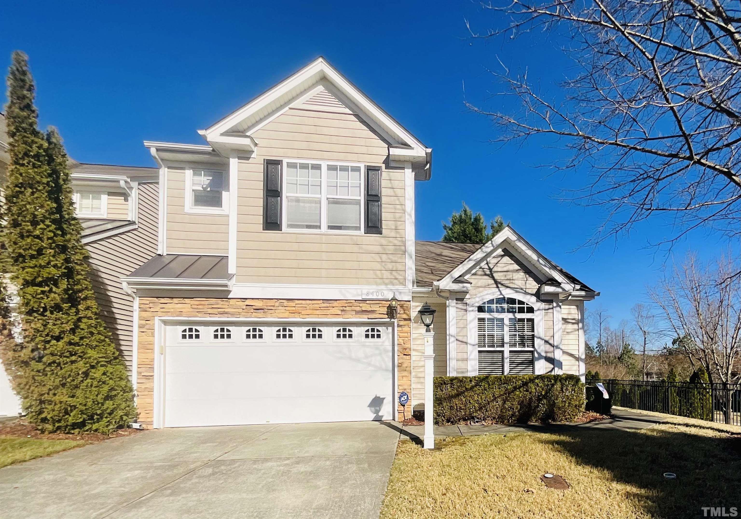 8400 Split Stone Lane Raleigh, NC 27613 - Photo 1 of 27 a front view of a house with a yard