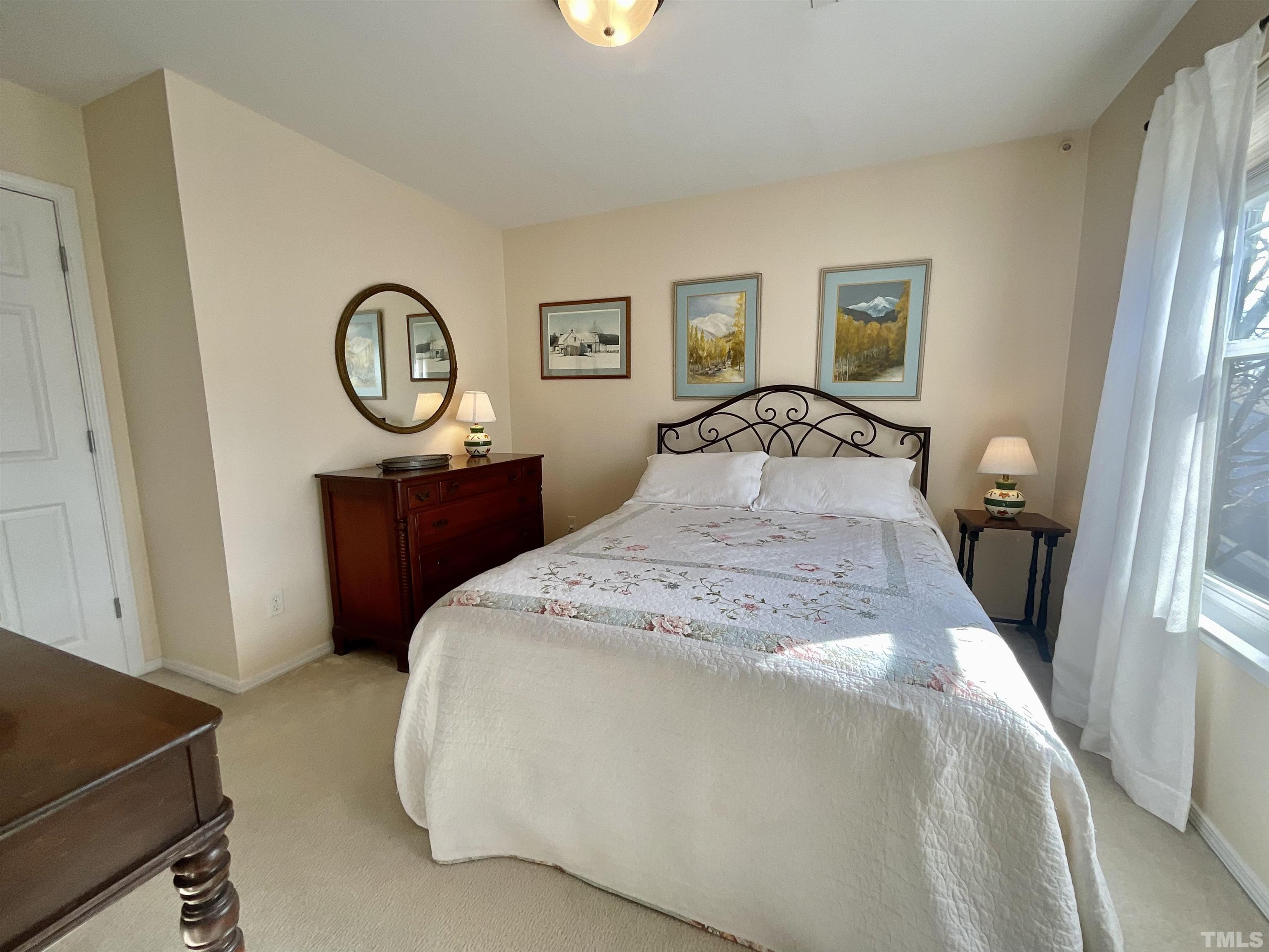 8400 Split Stone Lane Raleigh, NC 27613 - Photo 12 of 27 a bedroom with a bed and a window