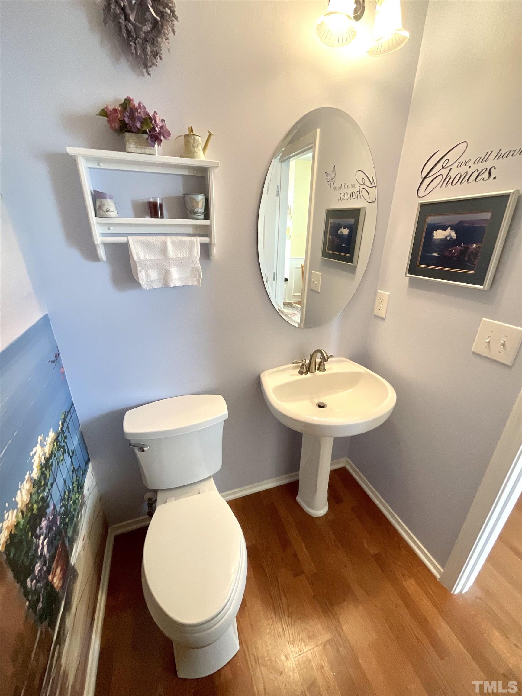 8400 Split Stone Lane Raleigh, NC 27613 - Photo 17 of 27 a bathroom with a toilet a sink and mirror