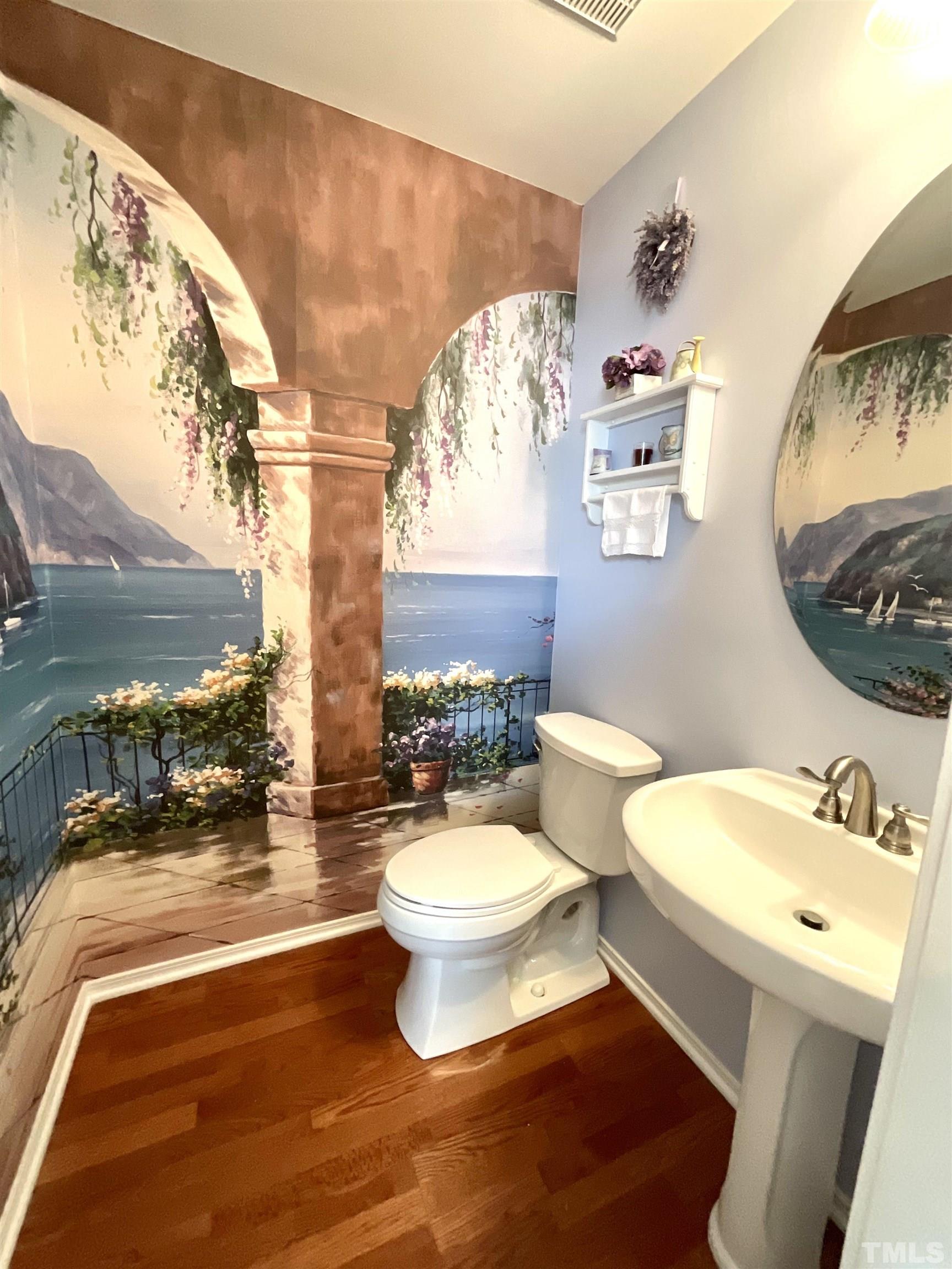 8400 Split Stone Lane Raleigh, NC 27613 - Photo 19 of 27 a bathroom with a toilet a sink and mirror