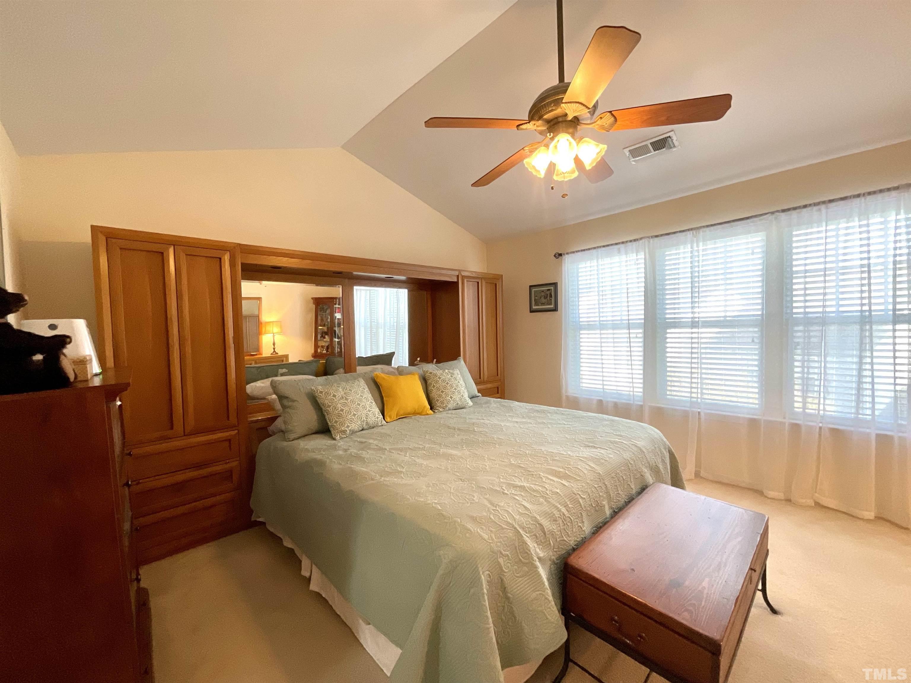 8400 Split Stone Lane Raleigh, NC 27613 - Photo 22 of 27 a bedroom with a bed and wooden floor