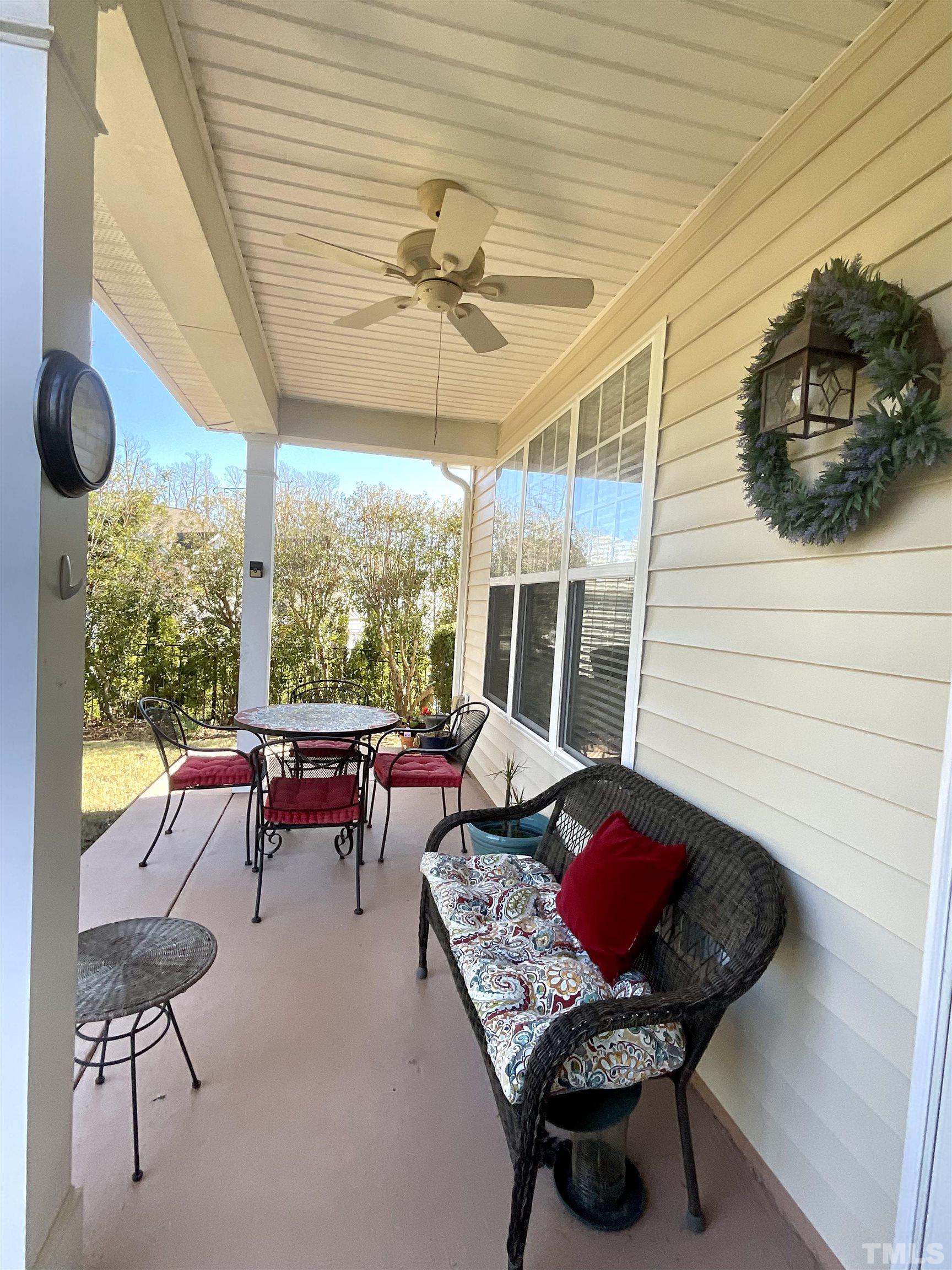 8400 Split Stone Lane Raleigh, NC 27613 - Photo 24 of 27 a outdoor space with patio the couches and a dining table with the garden view