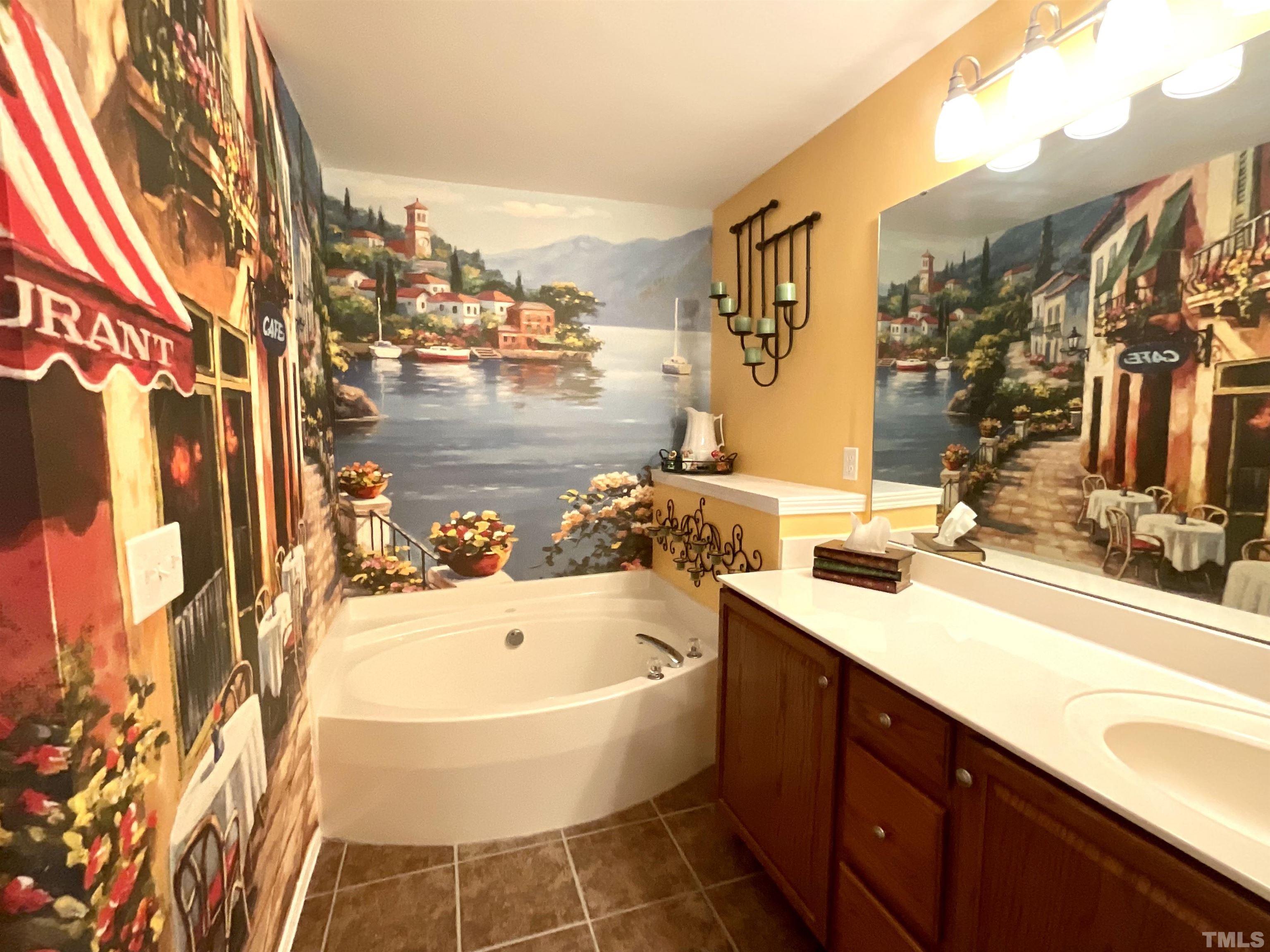 8400 Split Stone Lane Raleigh, NC 27613 - Photo 5 of 27 a bathroom with a tub sink and mirror