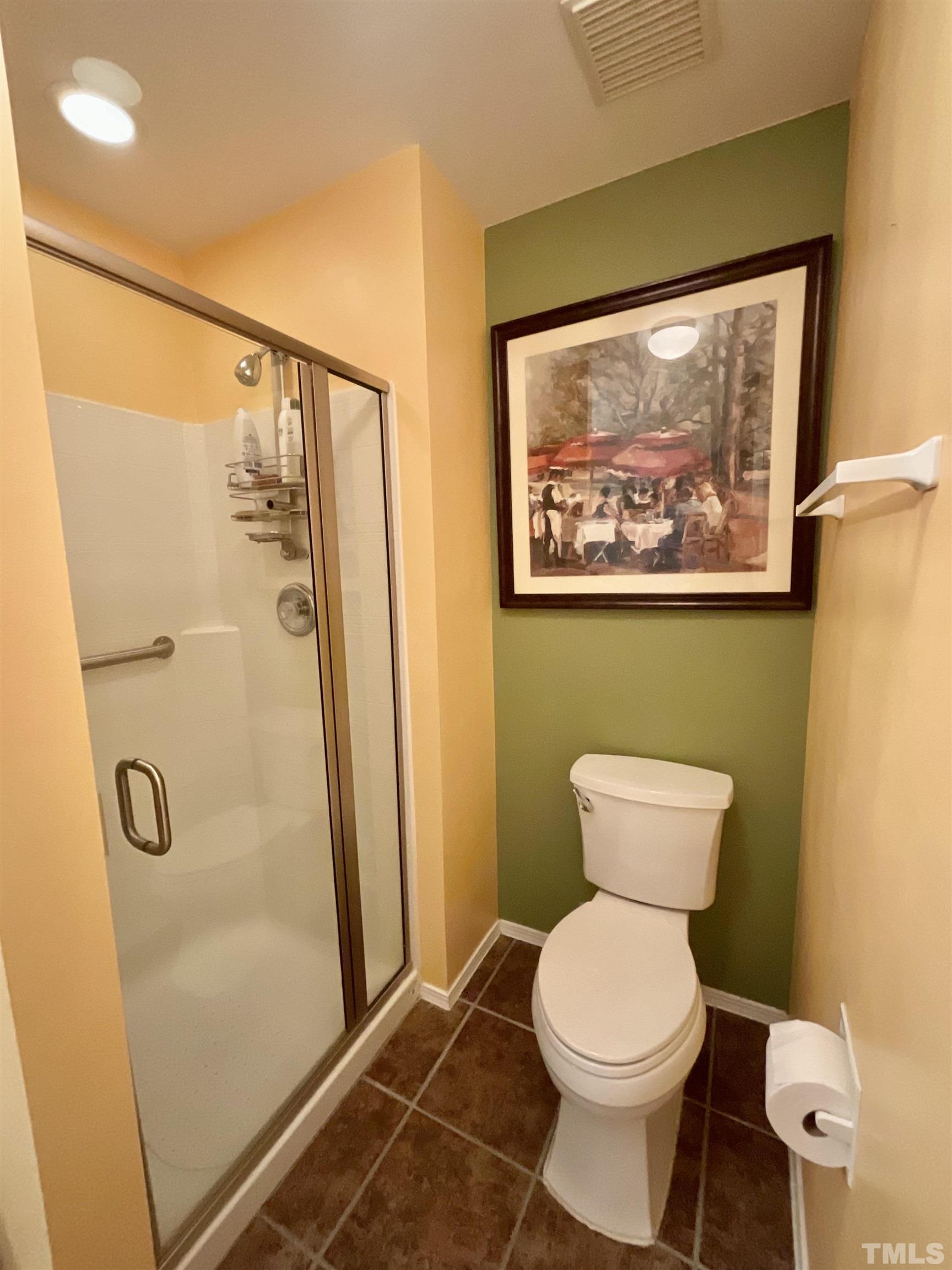 8400 Split Stone Lane Raleigh, NC 27613 - Photo 7 of 27 a bathroom with a toilet and a shower