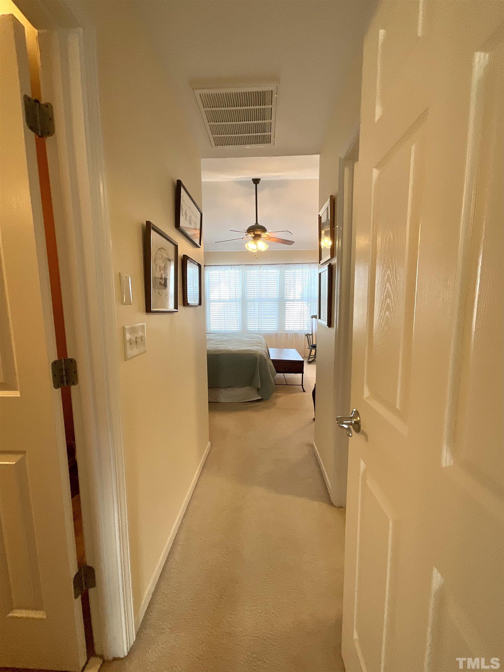 8400 Split Stone Lane Raleigh, NC 27613 - Photo 8 of 27 a view of a hallway with a furniture
