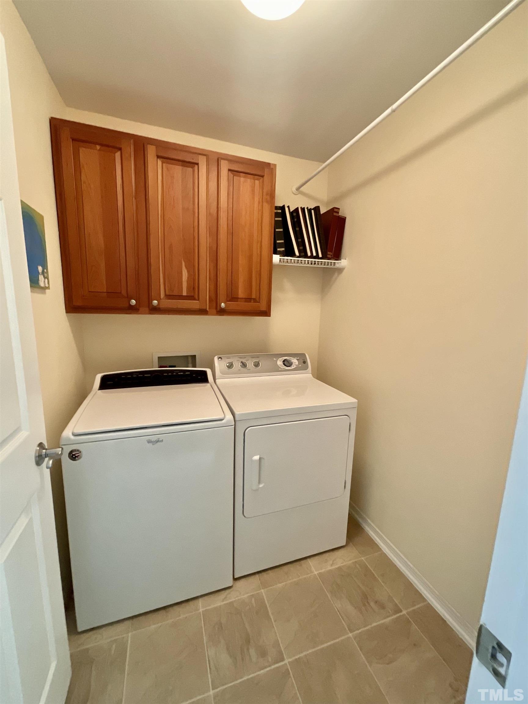 8400 Split Stone Lane Raleigh, NC 27613 - Photo 9 of 27 a utility room with dryer and washer