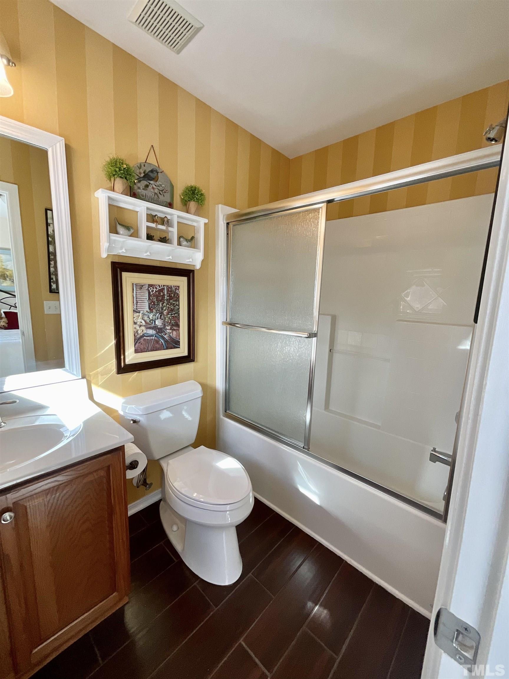 8400 Split Stone Lane Raleigh, NC 27613 - Photo 10 of 27 a bathroom with a toilet a sink and a shower