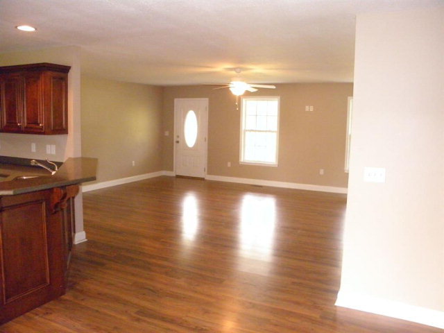 1218 Bowers Cemetery Road Cochran, GA 31014 - Photo 15 of 21 a view of a kitchen with wooden floor and a sink