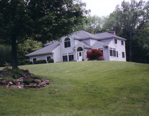 78 Walnut Tree Hill Road Newtown, CT 06482 - Photo 1 of 1 a front view of a house with a garden