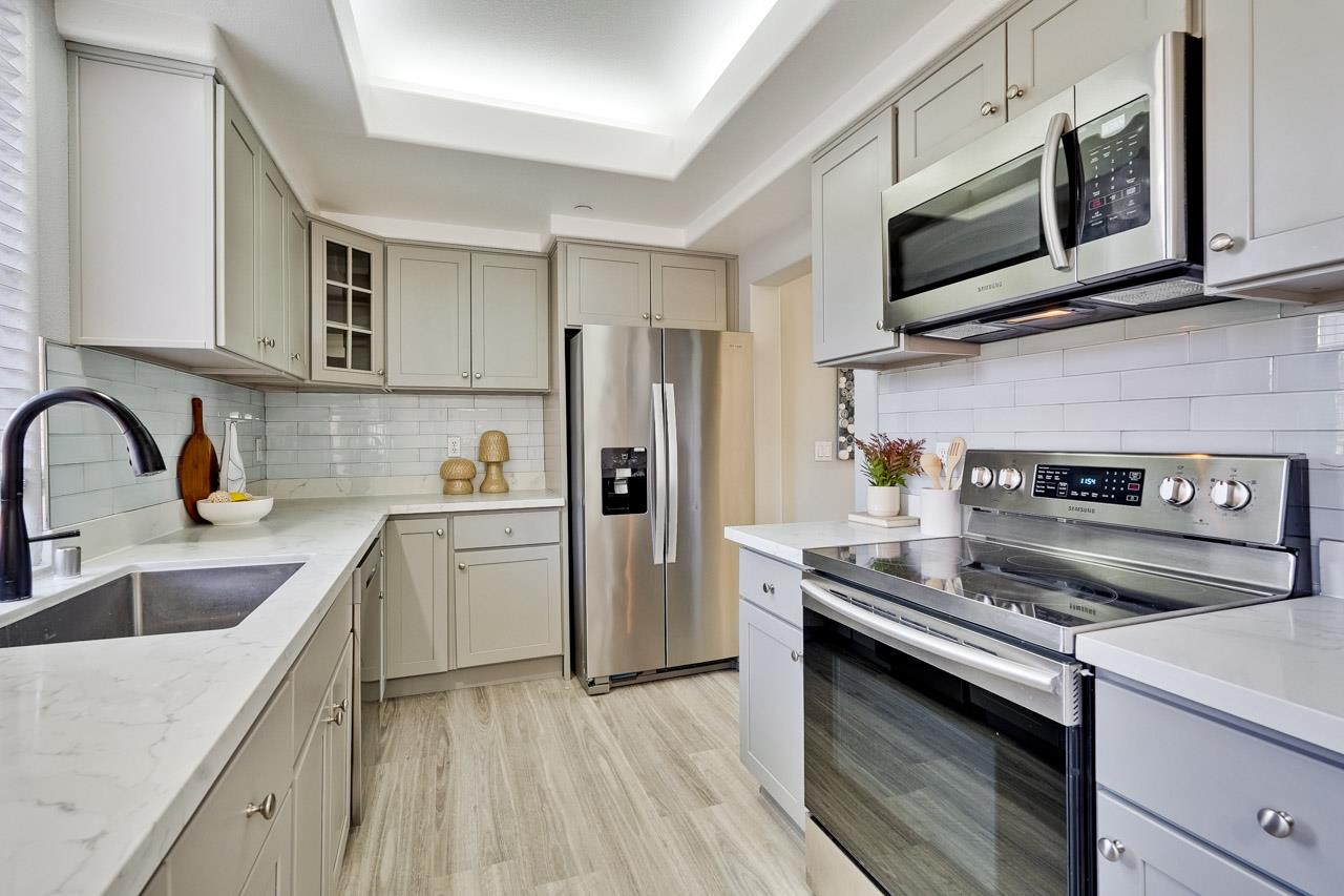 144 South 3rd Street, Unit 425 San Jose, CA 95112 - Photo 13 of 52 a kitchen with a sink stove and refrigerator