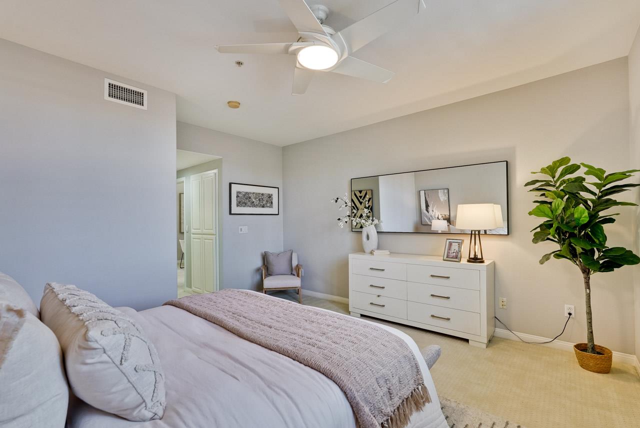 144 South 3rd Street, Unit 425 San Jose, CA 95112 - Photo 15 of 52 a bedroom with a bed and a potted plant