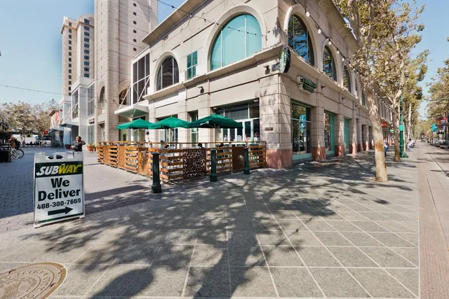 a view of an kitchen with furniture and clutter