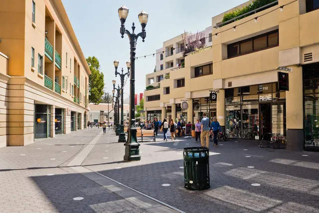 a view of a building with a floor to ceiling windows and a basket ball park