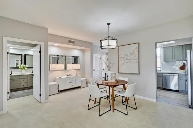 a dining room with furniture and window