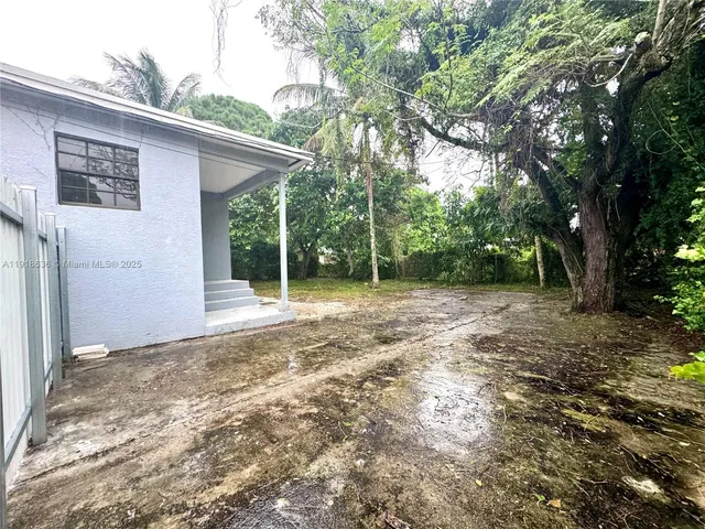 a view of backyard with green space