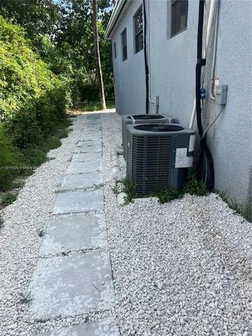 front view of a house with a garden