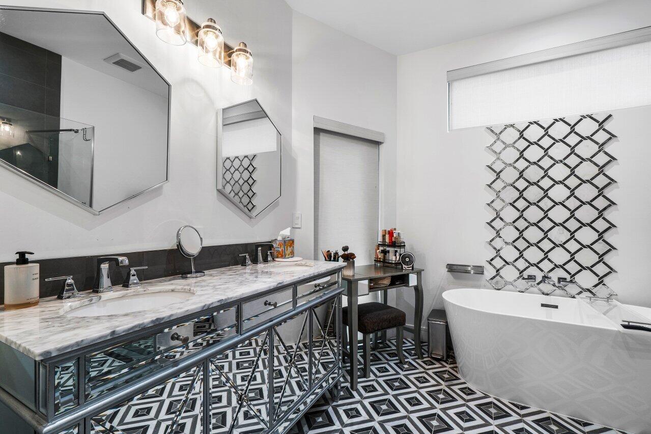 308 Enfield Road Delray Beach, FL 33444 - Photo 13 of 25 a bathroom with a granite countertop sink and a mirror