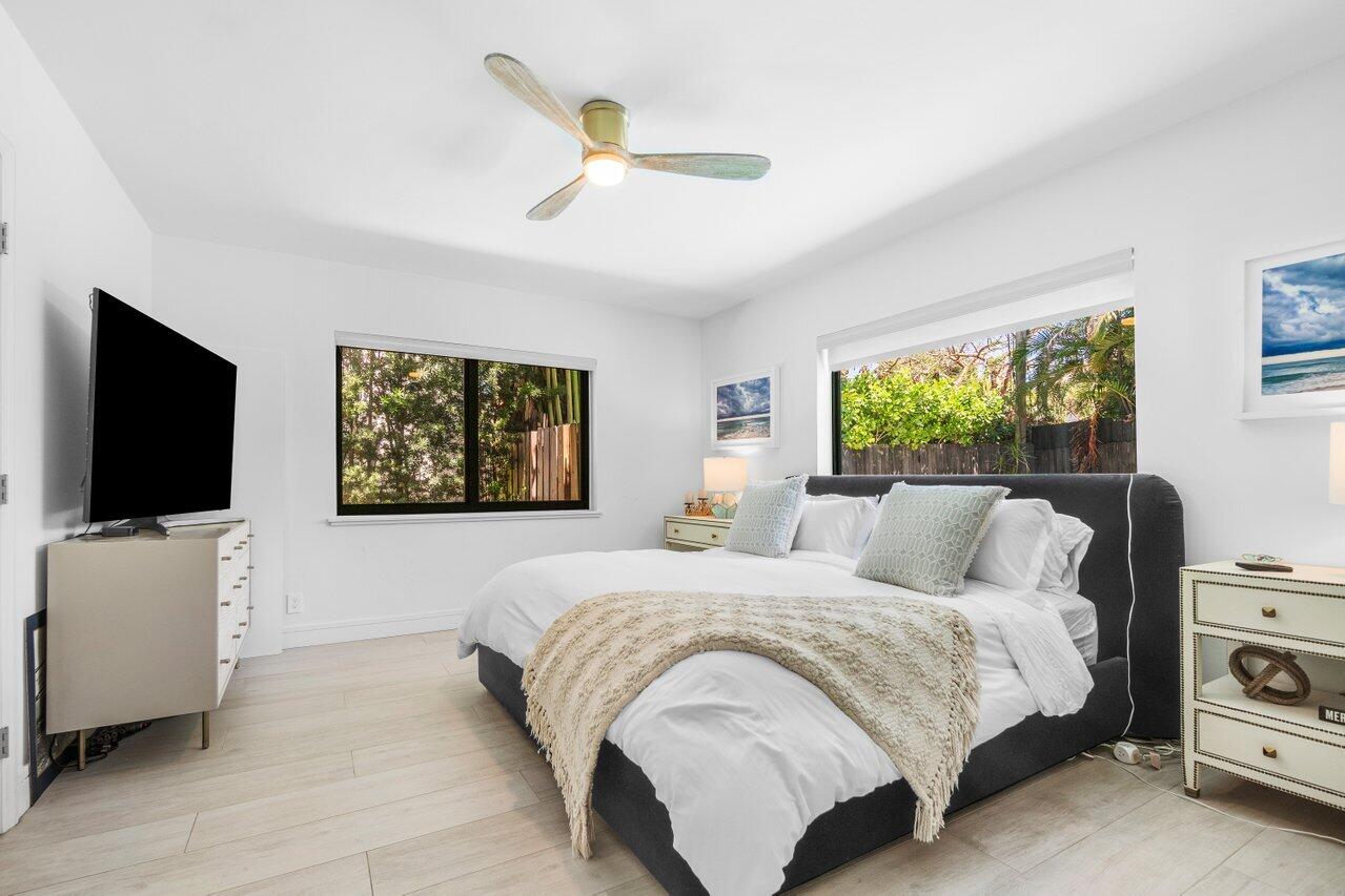 308 Enfield Road Delray Beach, FL 33444 - Photo 19 of 25 a bedroom with a bed and a flat screen tv