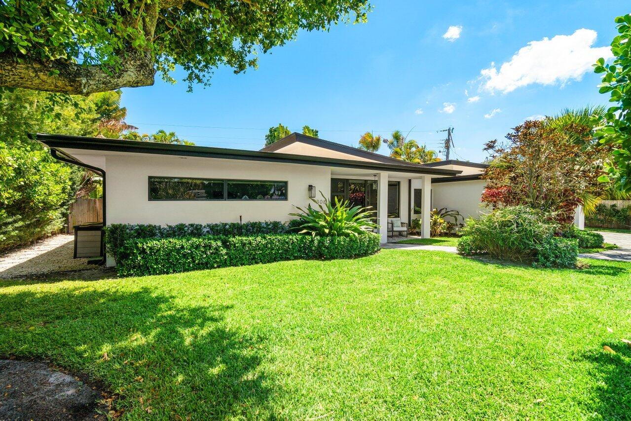 308 Enfield Road Delray Beach, FL 33444 - Photo 2 of 25 a view of house with a yard