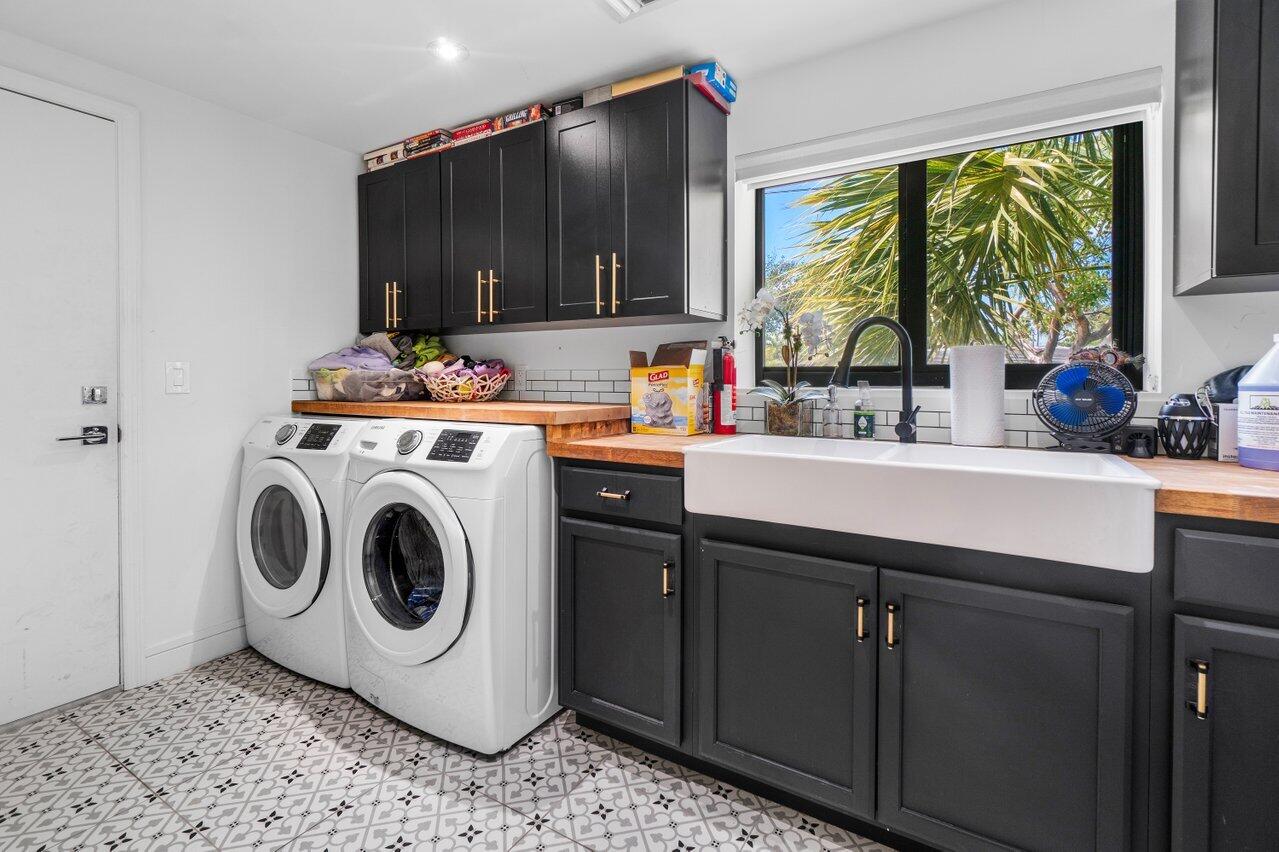308 Enfield Road Delray Beach, FL 33444 - Photo 22 of 25 a utility room with sink dryer and washer