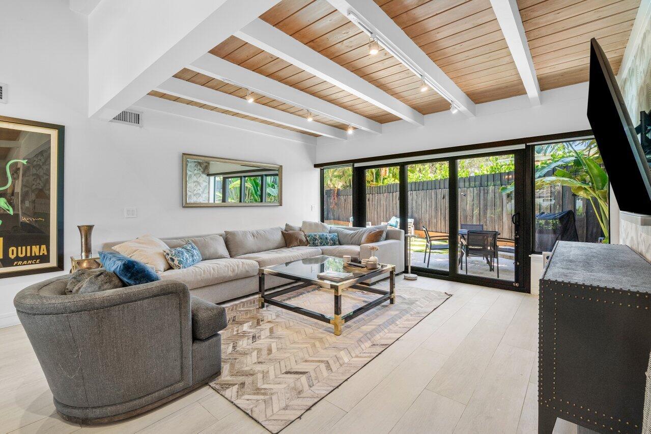 308 Enfield Road Delray Beach, FL 33444 - Photo 6 of 25 a living room with furniture and floor to ceiling windows