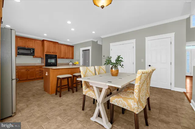 a kitchen with granite countertop a stove and a microwave
