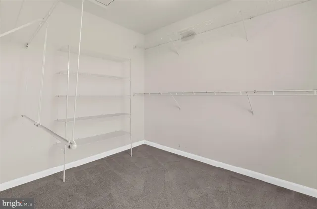 an aerial view of a residential houses with outdoor space swimming pool and lake view