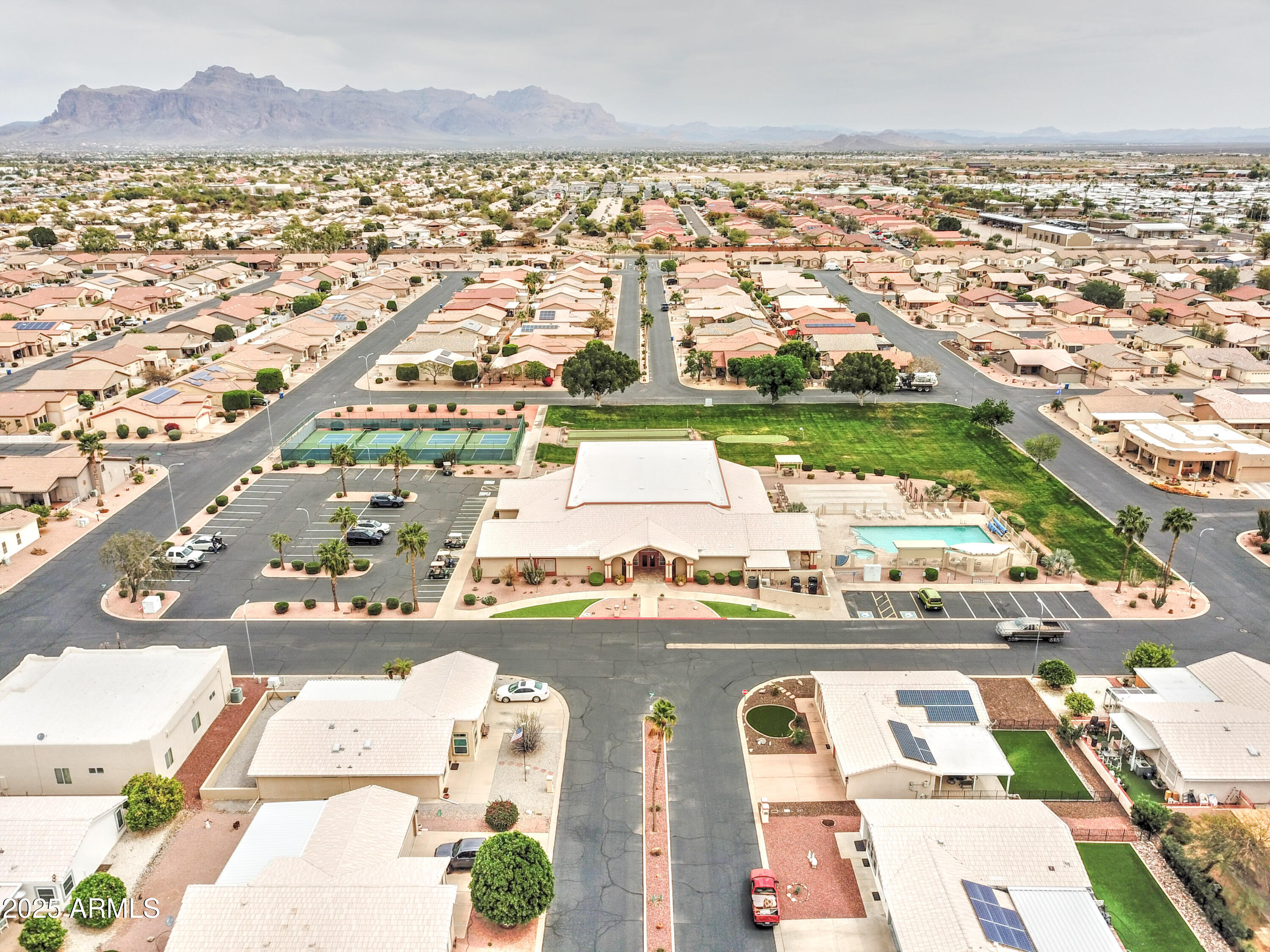 2101 South Meridian Road, Unit 72 Apache Junction, AZ 85120 - Photo 29 of 55 an aerial view of residential houses with outdoor space