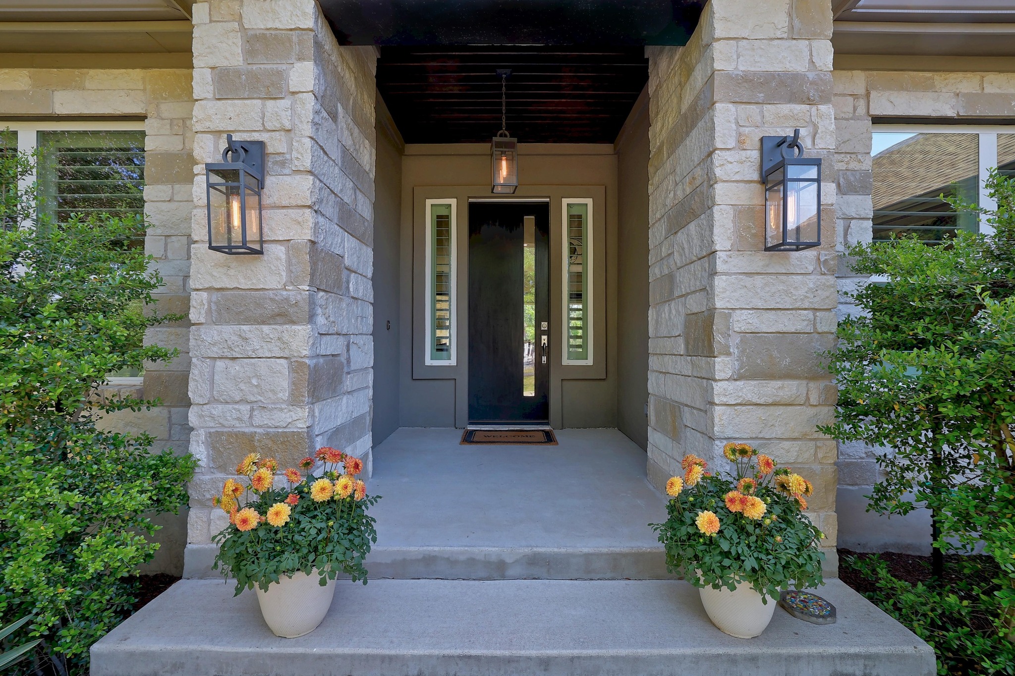105 Graystone Lane Georgetown, TX 78633 - Photo 3 of 32 View of exterior entry with stone siding