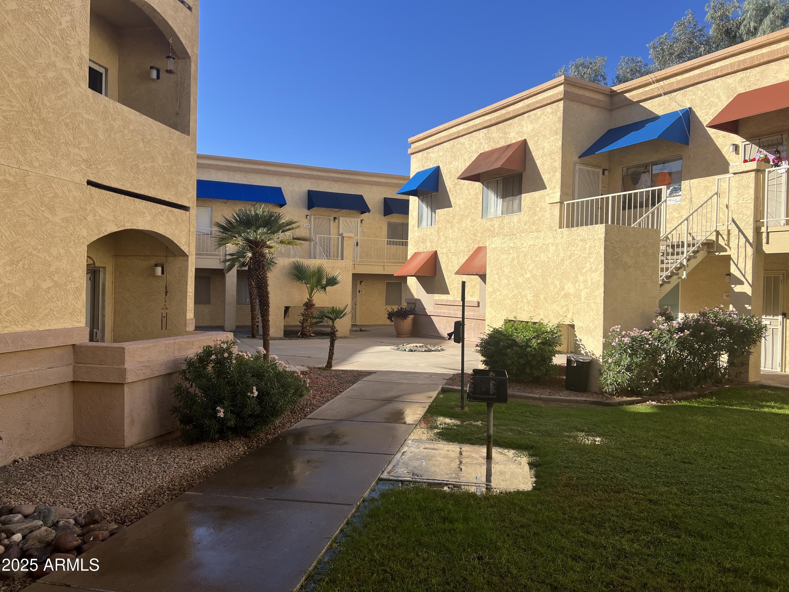 12221 West Bell Road, Unit 278 Surprise, AZ 85378 - Photo 2 of 24 a house view with a garden space