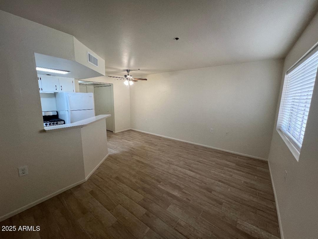 12221 West Bell Road, Unit 278 Surprise, AZ 85378 - Photo 4 of 24 wooden floor in an empty room