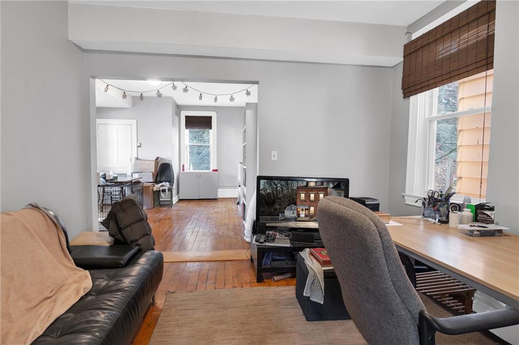 726 Evergreen Road Pittsburgh, PA 15209 - Photo 11 of 25 a living room with furniture and a large window