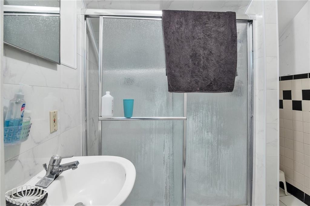 726 Evergreen Road Pittsburgh, PA 15209 - Photo 17 of 25 a bathroom with a sink and a mirror