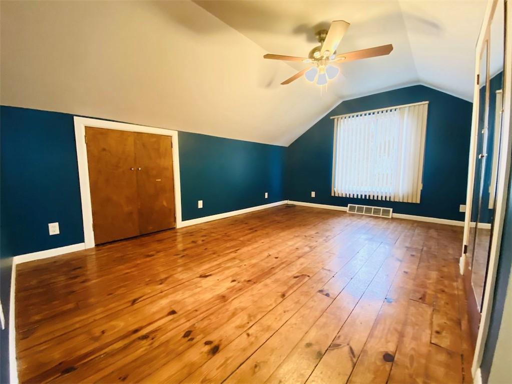 726 Evergreen Road Pittsburgh, PA 15209 - Photo 21 of 25 a view of an empty room with a chandelier fan