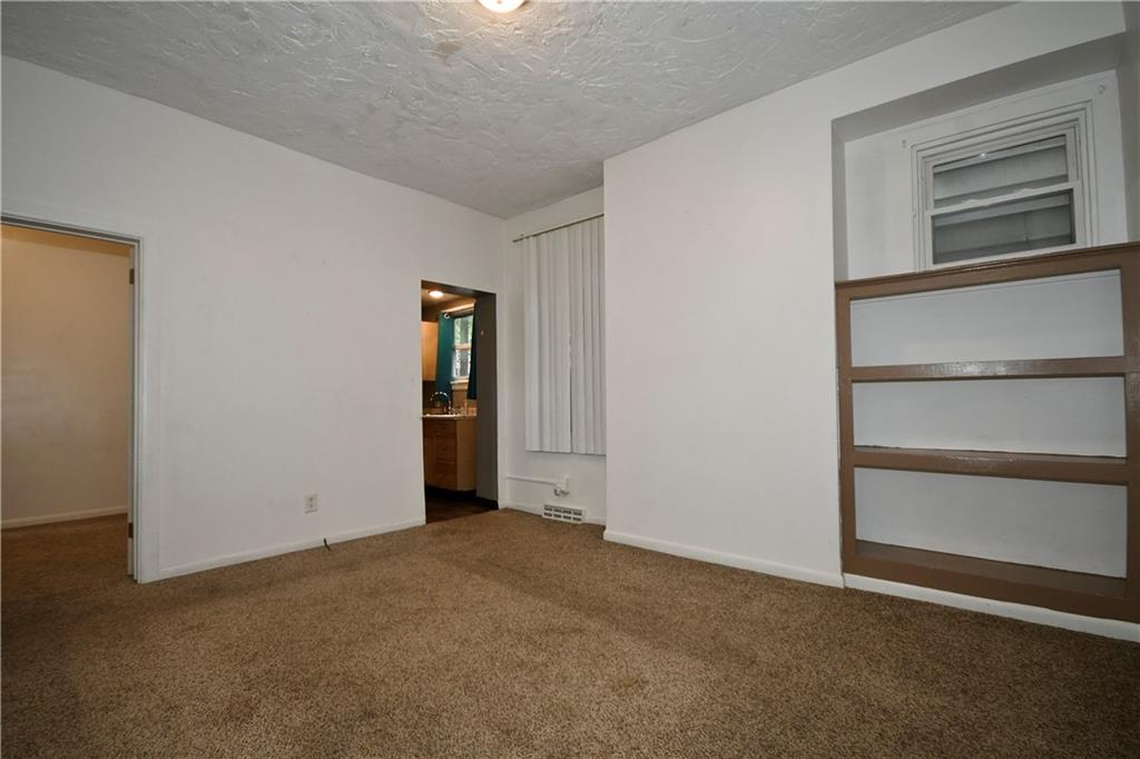 726 Evergreen Road Pittsburgh, PA 15209 - Photo 3 of 25 a view of an empty room with closet and a window
