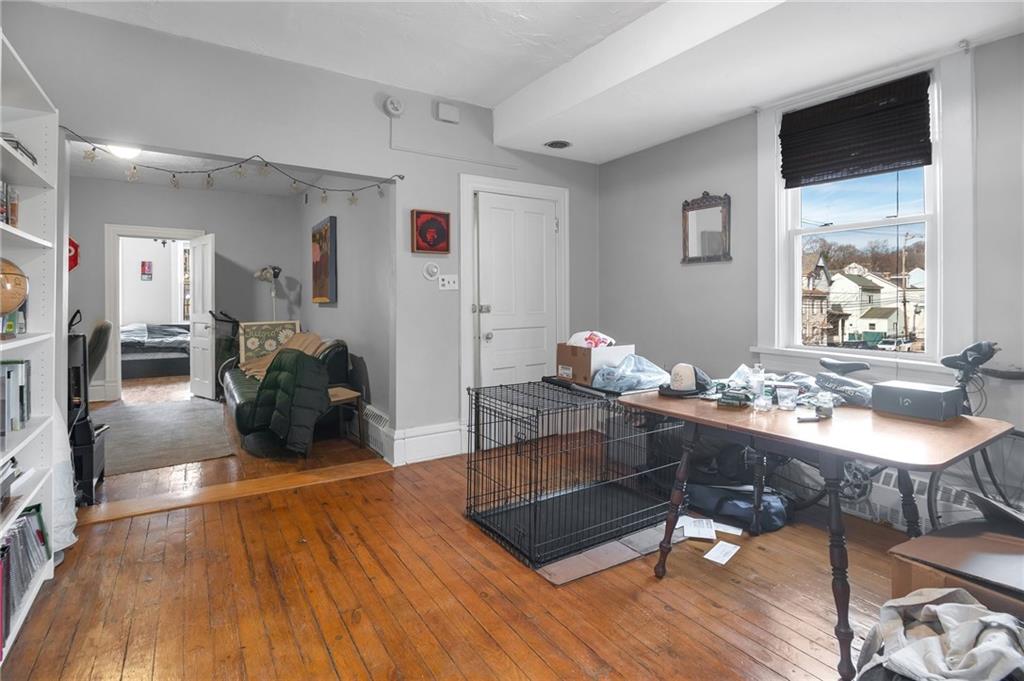 726 Evergreen Road Pittsburgh, PA 15209 - Photo 9 of 25 a living room with furniture hard wood floor and a table